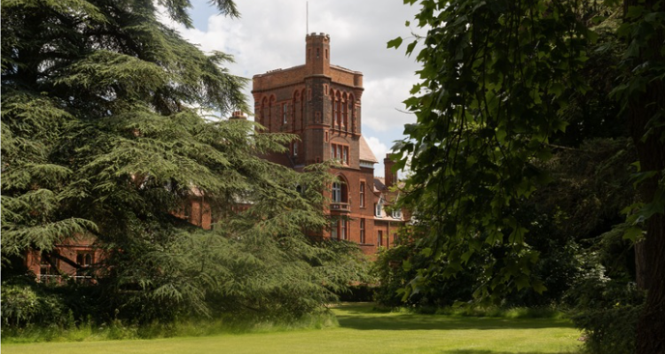 A photo of the Girton Tower through the trees